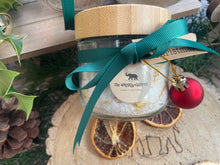 Natural handmade bath salts in jar with bamboo lid.