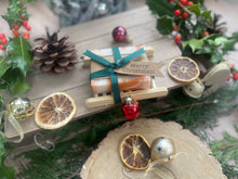 Christmas handcrafted natural soap bar and ladder, wrapped in ribbon with a Christmas tag and bauble.