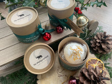 Natural, handmade bath bomb in Christmas themed kraft tube with ribbon, tag and bauble.