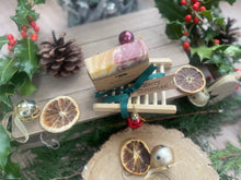 Christmas handcrafted natural soap bar and ladder, wrapped in ribbon with a Christmas tag and bauble.