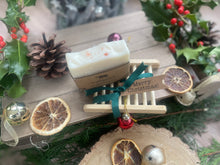 Christmas handcrafted natural soap bar and ladder, wrapped in ribbon with a Christmas tag and bauble.