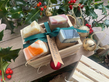 Beautiful box of natural, handmade mini soap bars with ribbon and a 'Merry Christmas!' tag, 