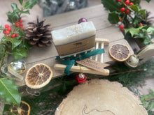 Christmas handcrafted natural soap bar and ladder, wrapped in ribbon with a Christmas tag and bauble.