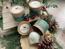 Natural, handmade bath bomb in Christmas themed kraft tube with ribbon, tag and bauble.