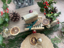 Christmas handcrafted natural soap bar and ladder, wrapped in ribbon with a Christmas tag and bauble.