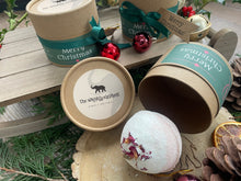 Natural, handmade bath bomb in Christmas themed kraft tube with ribbon, tag and bauble.