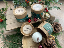 Natural, handmade bath bomb in Christmas themed kraft tube with ribbon, tag and bauble.