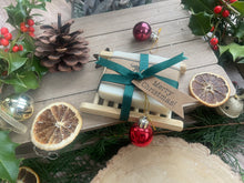 Christmas handcrafted natural soap bar and ladder, wrapped in ribbon with a Christmas tag and bauble.