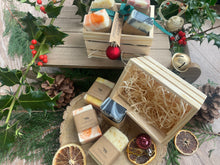 Beautiful box of natural, handmade mini soap bars with ribbon and a 'Merry Christmas!' tag, 