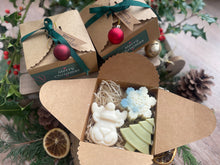 Christmas-themed gift box with natural handmade Christmas soaps.