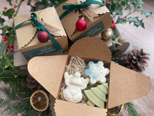 Christmas-themed gift box with natural handmade Christmas soaps.