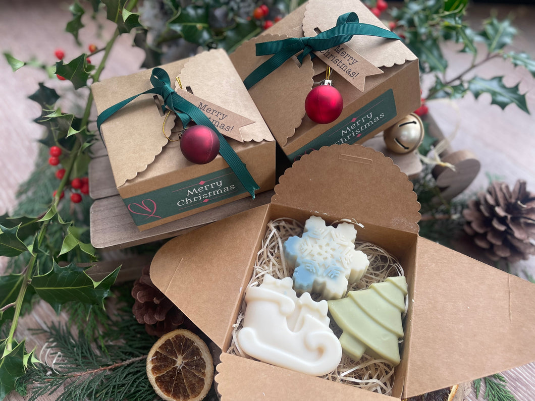 Christmas-themed gift box with natural handmade Christmas soaps.