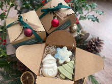 Christmas-themed gift box with natural handmade Christmas soaps.