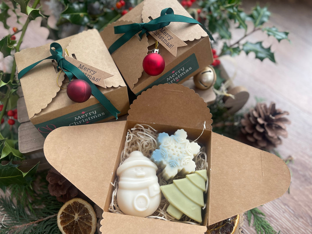 Christmas-themed gift box with natural handmade Christmas soaps.